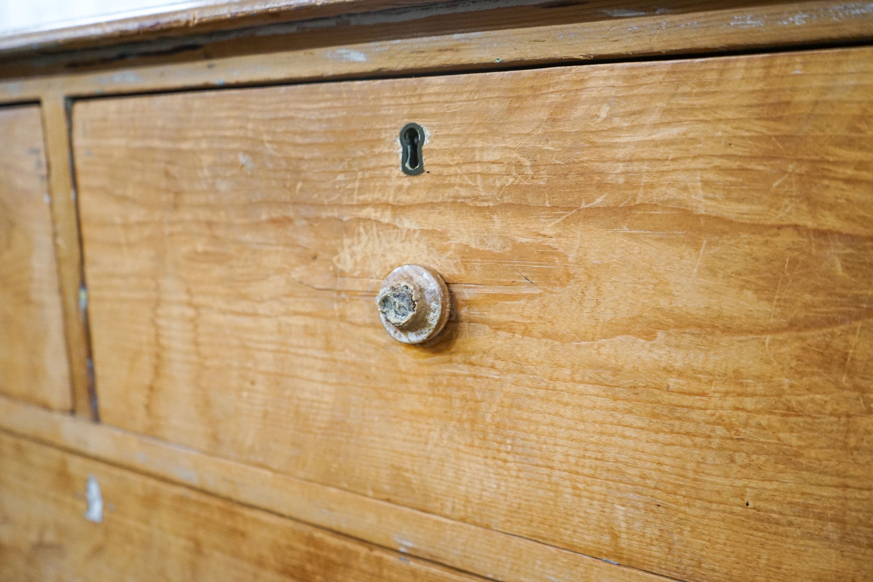 A Victorian stripped pine chest of drawers (lacking feet), width 95cm, depth 53cm, height 74cm